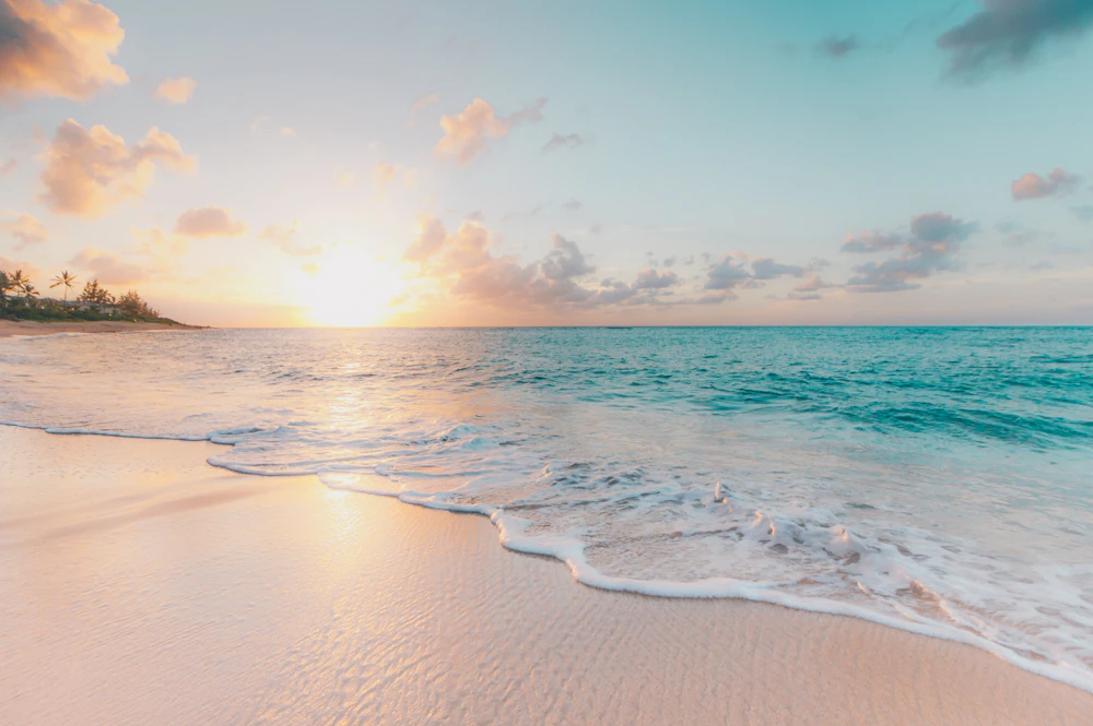 A calm ocean at sunrise after a storm, symbolizing market recovery following a crypto crash